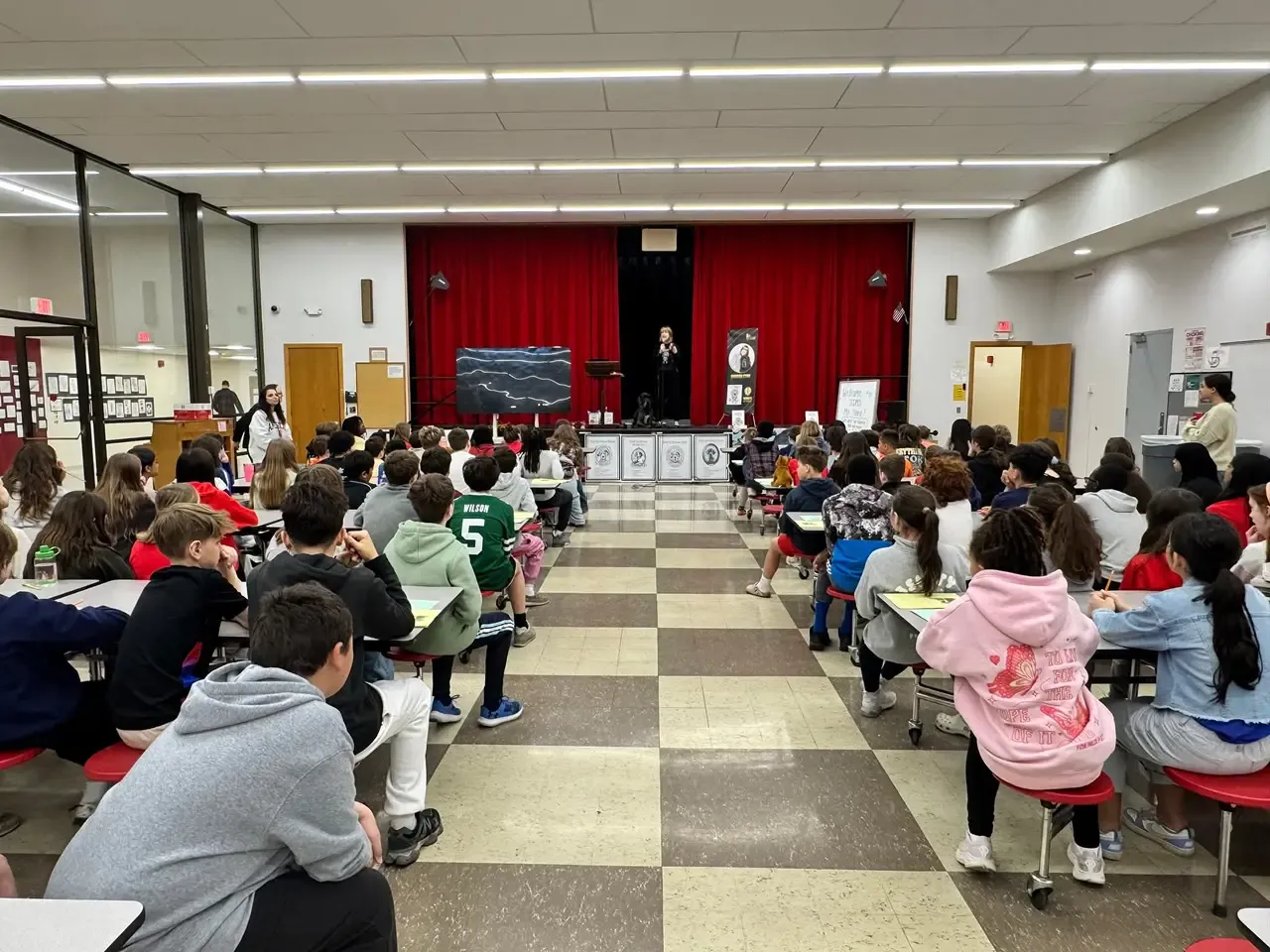 Barb Stone speaking to students at a school